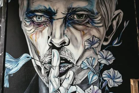 Wall mural of a man making a shush gesture Stock Photos