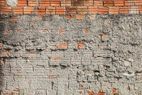 Wall mute with plaster and some exposed bricks Foto stock