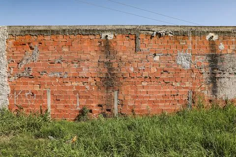 Wall mute with plaster and some exposed bricks Stock Photos