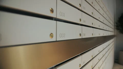 Wall of numbered mailboxes in modern building Stock Footage 311048135