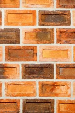 Wall from old antique brick, texture of orange brick wall, curly neat brickwo Stock Photos