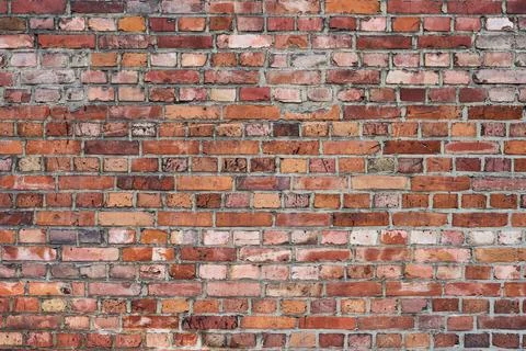 Wall of an old building built of red bricks 库存照片
