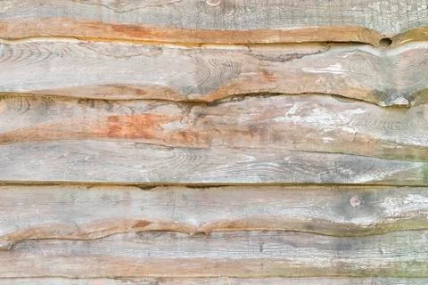 Wall from old edging boards overlapped on each other as a background Stock Photos