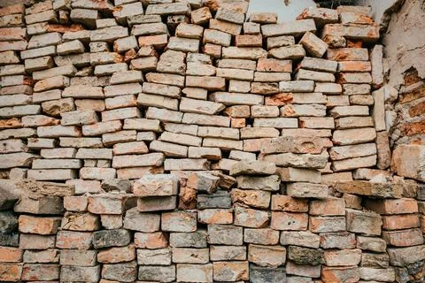 Wall with old red bricks. Textured background Stock Photos