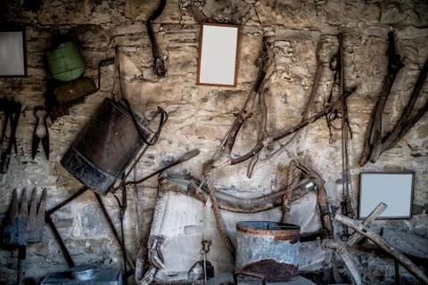 Wall with old stuff and tools Stock Photos