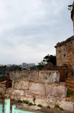 The wall of the old tower. The brick collapsed the fence. Antalya, Turkey, Ap Stock Photos