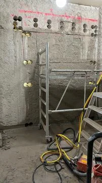 Wall opening work in progress on building site involving concrete modificat.. Foto stock