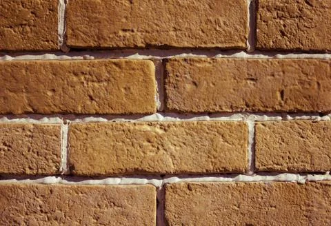 Wall of orange bricks. Stock Photos