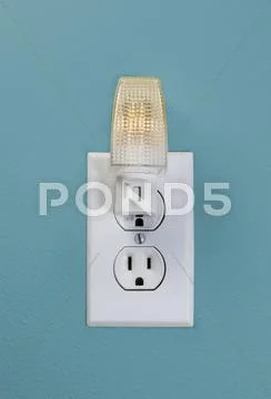 Wall outlet light for night time Stock Photos