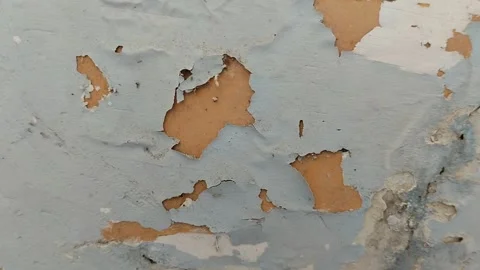 Wall paint that is peeling because the wall is damp Stock Footage 285590757