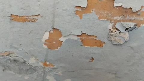Wall paint that is peeling because the wall is damp Stock Footage 285590780