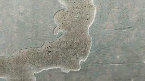 Wall paint that is peeling because the wall is damp Stock Footage 285591195