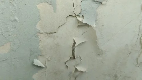 Wall paint that is peeling because the wall is damp Stock Footage 286017341