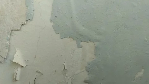 Wall paint that is peeling because the wall is damp Stock Footage 286017343