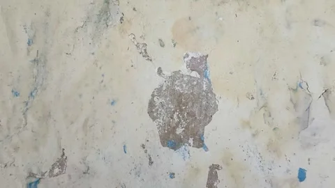 Wall paint that is peeling because the wall is damp Stock Footage 328134763