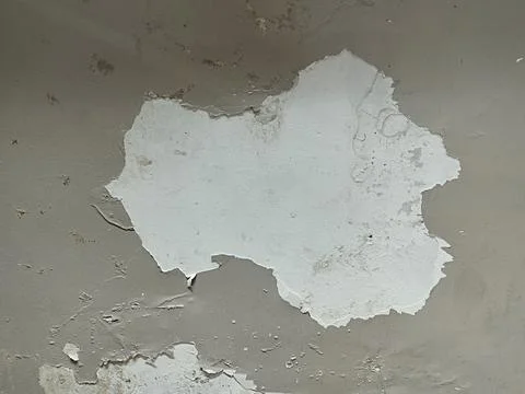 Wall paint peeling off like forming a map of Australia Stock Photos