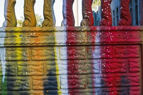 Wall painted with bright colors as a texture. Abstract drawings on the wall. Stock Photos