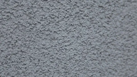 The wall is painted in gray plaster Video stock 77599019