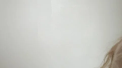 The wall is painted with white paint with a paint Stock Footage 153256538