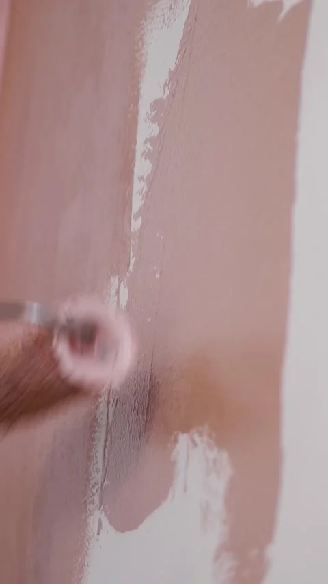 Wall painting. water-based paint. roller painting. repair. close-up. Painting Stock Footage 314980412