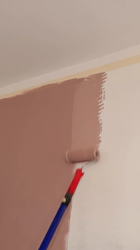 Wall painting. water-based paint. roller painting. repair. close-up. Painting Stock Footage 315218997
