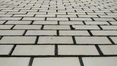 Wall of pale yellow brick. bottom view Stock Photos