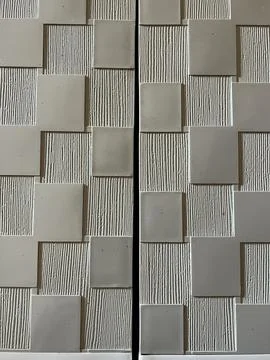 Wall panel with abstract checkerboard geometric pattern and embossed line Stock Photos