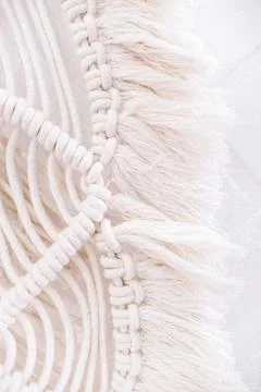 Wall panel in boho style made of cotton threads of natural color Stock Photos