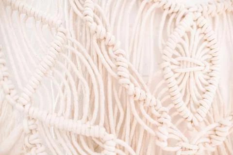Wall panel in boho style made of cotton threads of natural color Foto stock