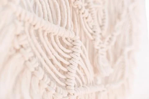 Wall panel in boho style made of cotton threads of natural color Stock Photos