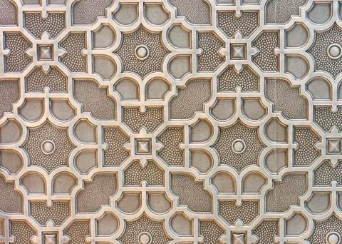Wall panel in brown tones with a three-dimensional ornament. 스톡 사진