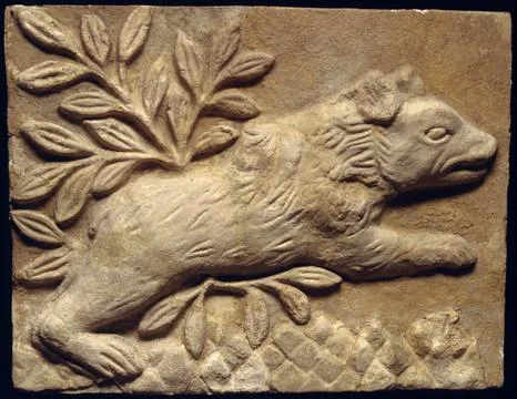 Wall panel with a charging bear ca. 6th century A.D. Sasanian Animal motifs.. Fotos Stock