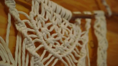 Wall panel woven in the macrame style from white cotton threads. Stock Footage 283127570