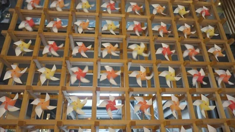 Wall of paper pinwheels spinning in the wind Stock Footage 233226700