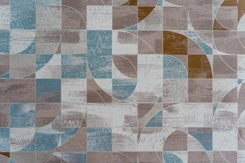 A wall with a patterned design and a white background Stock Photos