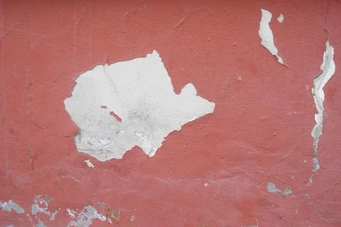 Wall with peeling paint in a simple building setting Stock Photos