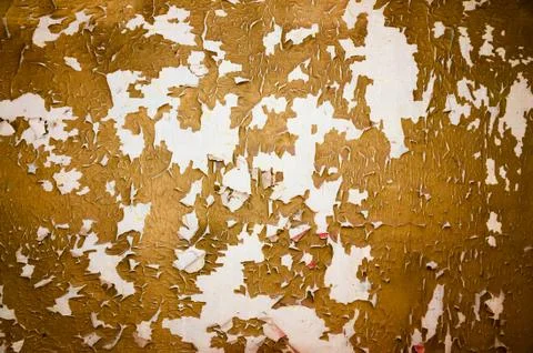 Wall with peeling plaster orange color. 스톡 사진