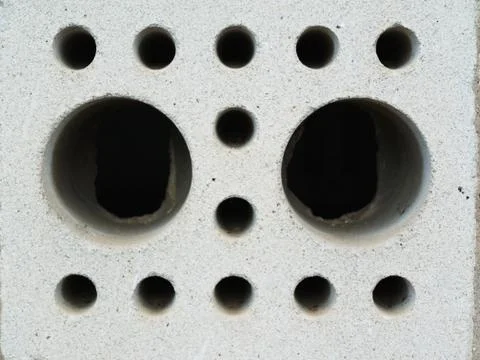 Wall of perforated bricks blowup Stock Photos