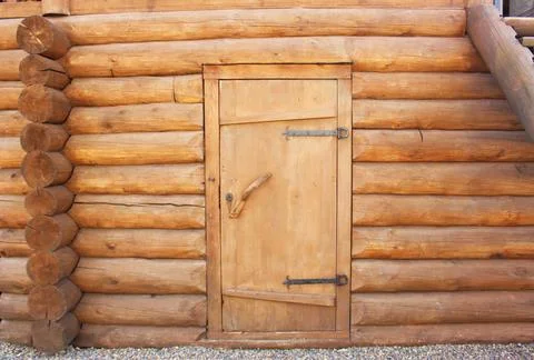 Wall of pine logs. Texture of a horizontal wooden wall. Wood wall texture for Stock Photos