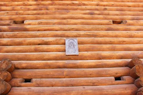 Wall of pine logs. Texture of a horizontal wooden wall. Wood wall texture for Stock Photos