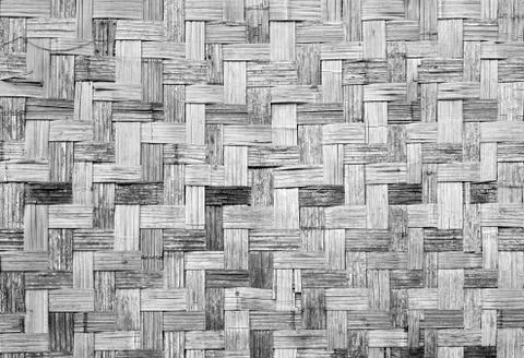 Wall of plaited bamboo strips vernecular outdoor grey scale Stock Photos