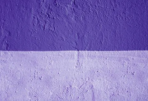 A wall with a plaster texture, painted in two colors. Stock Photos