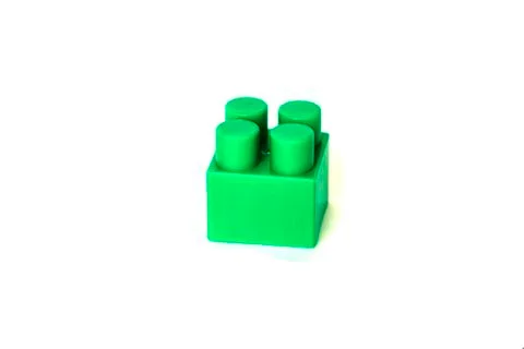Wall from Plastic building blocks isolated on white background. Stock Photos