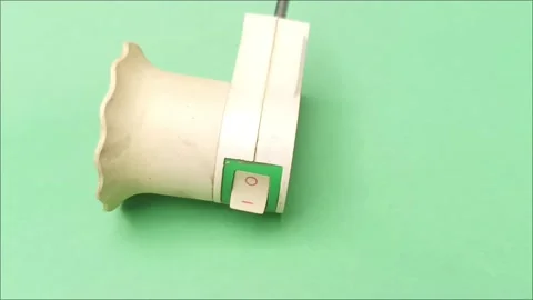 Wall Plug Light Bulb Socket Adapter with Switch on Green Background Stock Footage 335191730