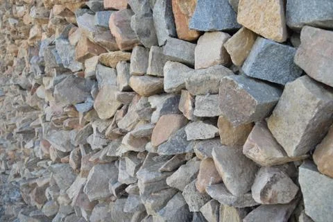 Wall of pointed and irregulars rocks, on perspective. Stock Photos