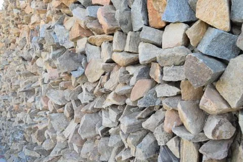 Wall of pointed and irregulars rocks, on perspective. Stock Photos