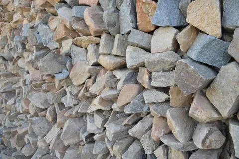Wall of pointed and irregulars rocks, on perspective. Stock Photos