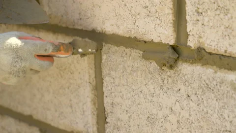 Wall Pointed Up By Brick Layer With Pointer Tool Video stock 239757584