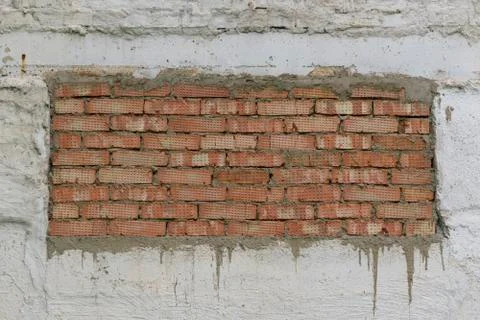 Wall with rectangle red brick insert. Foto stock