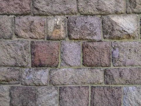 Wall of rectangular and square blocks in different tones of pink and beige Stock Photos
